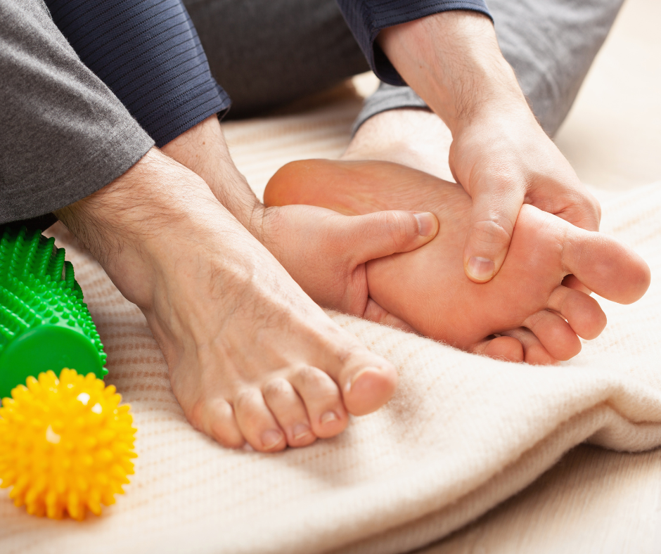 man massaging foot