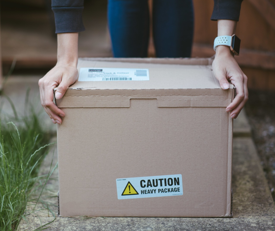 person holding a heavy package